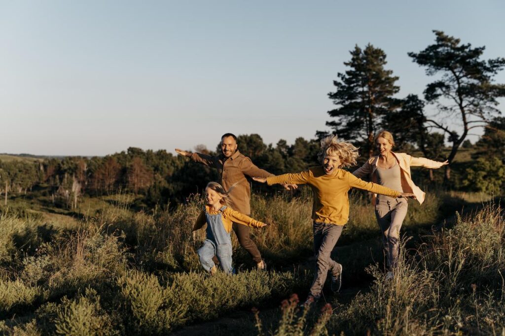 full shot-family-running-meadow