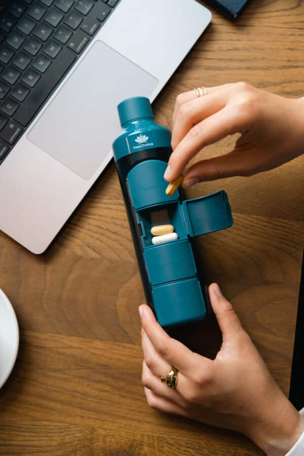 Vitamine in fles mee naar werk